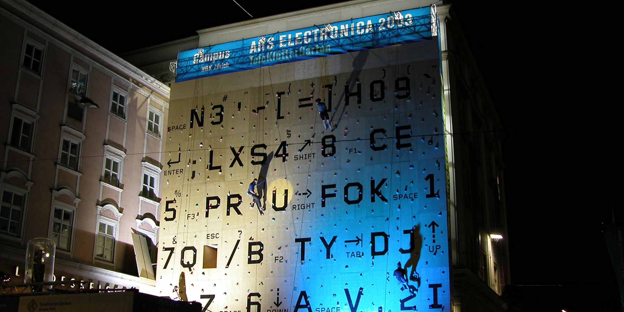 <strong>2003:</strong> An oversized computer keyboard as a climbing wall on the facade of the Linz Art University. This is the "Teleklettergarten".