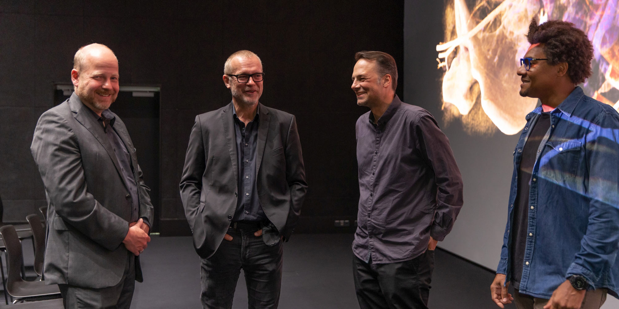 Happy developers of "Cinematic Anatomy x Deep Space": Klaus Engel of Siemens Healthineers with CTO Horst Hörtner, Technical Director Roland Haring and Friedrich Bachinger from the Ars Electronica Futurelab